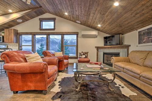 a living room with leather furniture and a fireplace at Cle Elum Lake Bunkhouse with Shared Hot Tub and Views! in Ronald