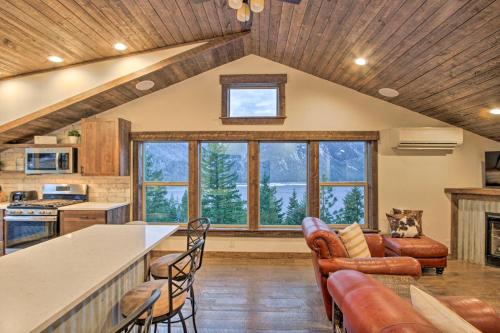 a kitchen and living room with a table and chairs at Cle Elum Lake Bunkhouse with Shared Hot Tub and Views! in Ronald