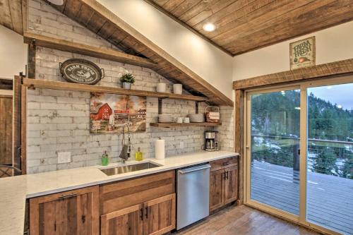 a kitchen with a sink and a window at Cle Elum Lake Bunkhouse with Shared Hot Tub and Views! in Ronald