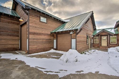 a wooden house with snow in front of it at Cle Elum Lake Bunkhouse with Shared Hot Tub and Views! in Ronald