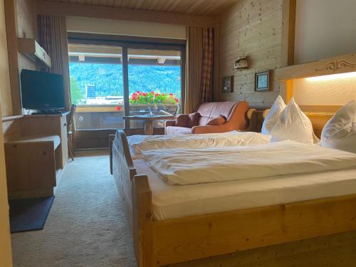 Postel nebo postele na pokoji v ubytování Landhotel Strasserwirt