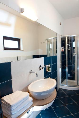 a bathroom with a sink and a shower at BV Borgo Del Principe in Zambrone