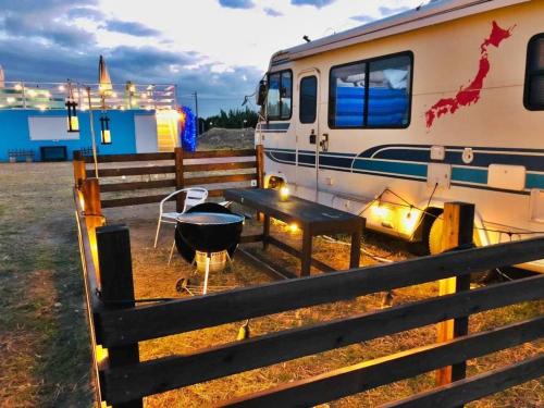 an rv with a grill and a table next to it at GRAN BLUE - Vacation STAY 11224v in Minamiboso