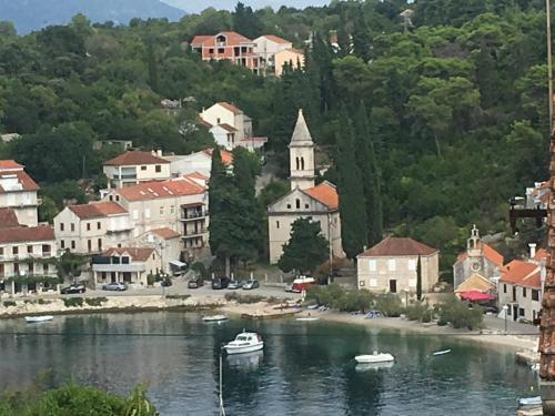 a town with boats in a body of water at High View-A Seaside Villa With Huge Jacuzzi in Račišće