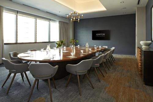 a large conference room with a long table and chairs at Kimpton Sawyer Hotel by IHG in Sacramento