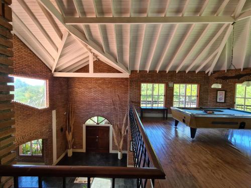 a large room with a pool table in it at La Barraca Resort in Merlo