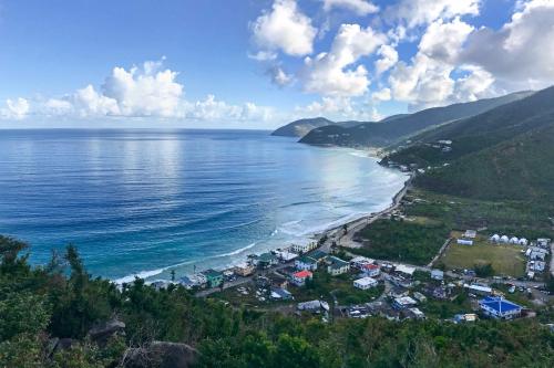a view of a beach with houses and the ocean at Tortola Adventure Private Villa Ocean-View Pool in Freshwater Pond