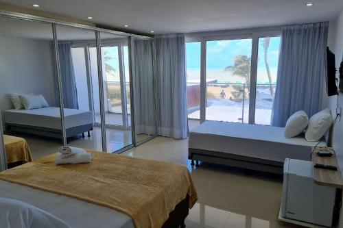 Casa de hóspedes Ideal para viagem em dupla Beira-mar Linda Suíte Frente Mar no Na Praia Menor preço em Casa de hóspedes Ideal para viagem em dupla Beira-mar Linda Suíte Frente Mar no Na Praia