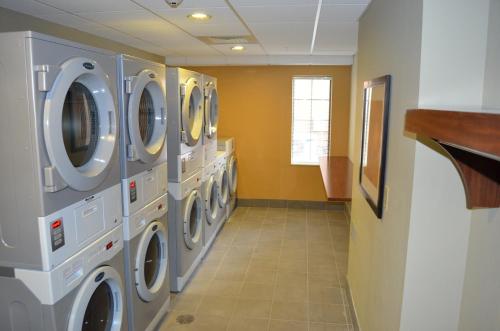 a laundry room with several washing machines in it at Staybridge Suites Bowling Green by IHG in Bowling Green