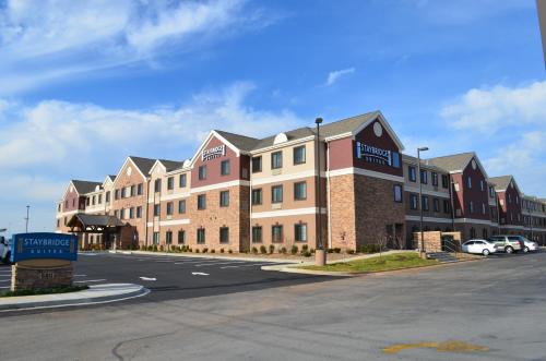 a building on the corner of a street at Staybridge Suites Bowling Green by IHG in Bowling Green