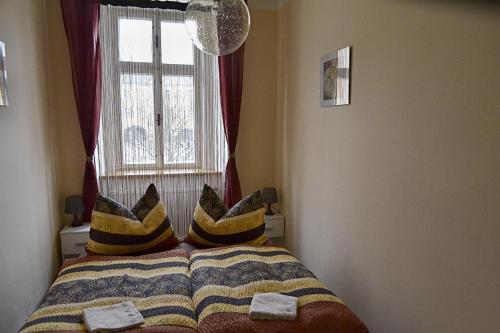Postel nebo postele na pokoji v ubytování Apartmán Náměstí Hostinné