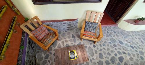 two chairs sitting on the floor in a room at Hotel & Restaurante Arca de Noé in Santa Cruz La Laguna