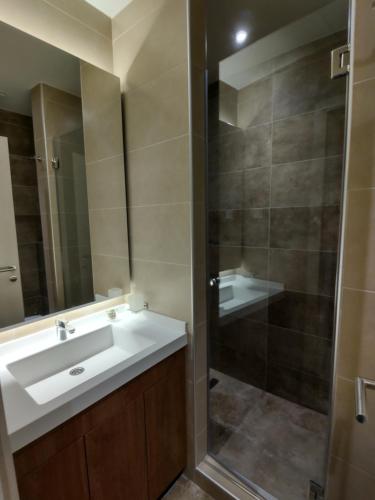 a bathroom with a sink and a shower at Star Hill - Koznik Konaci in Kopaonik