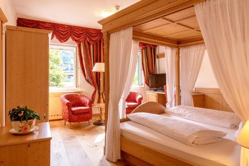 Ένα ή περισσότερα κρεβάτια σε δωμάτιο στο Hotel Goldenes Roessl-adults only