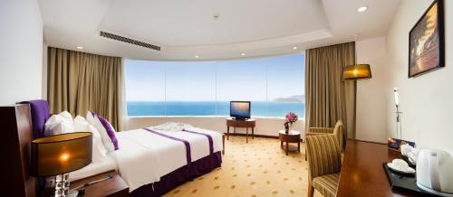 מיטה או מיטות בחדר ב-TTC Hotel - Michelia