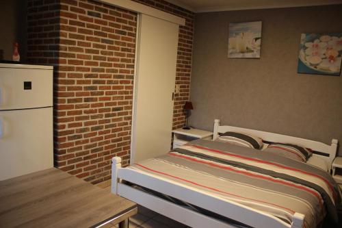Una cama o camas en una habitación de Breeden Steeger Hoeve