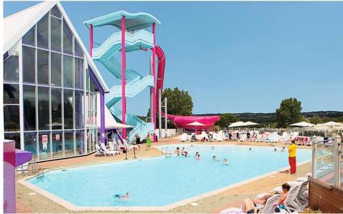 a large swimming pool with a water slide at Comfortable 3-Bed Caravan - Combe Haven in Hollington