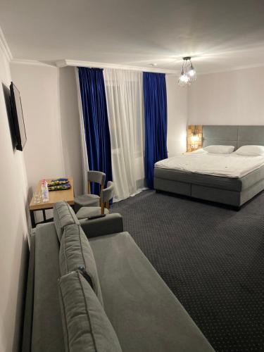 Postel nebo postele na pokoji v ubytování Grofa Apartments