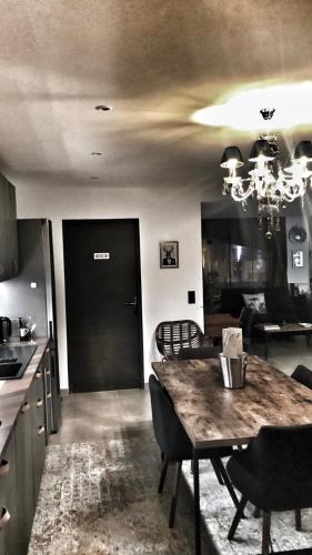 a kitchen and dining room with a table and chairs at LOFT La Grande Motte in La Grande-Motte