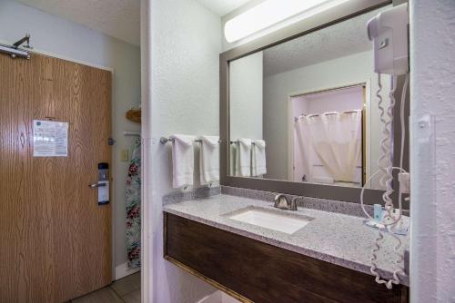 A bathroom at Quality Inn & Suites West