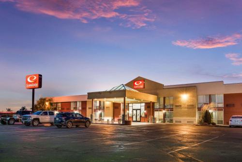 a gas station with cars parked in a parking lot at Econo Lodge Grand Junction North in Grand Junction
