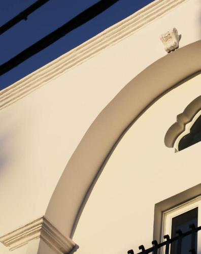 an archway on the side of a building at Palazzo Maritati in Nardò