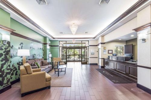 a living room with a couch and a table at Sleep Inn & Suites Smithfield near I-95 in Smithfield