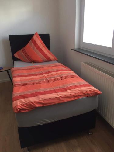Кровать или кровати в номере Ferienhaus Fräulein Frenz