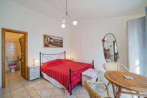 En eller flere senge i et værelse på Cottage Casa Gina - Goelba