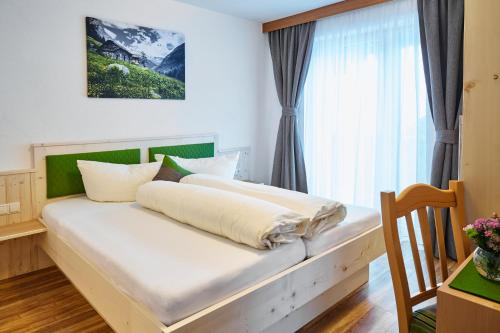 Postel nebo postele na pokoji v ubytování Gasthof Walderhof