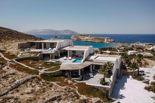 an aerial view of a house on a hill at Agalia Luxury Suites in Tzamaria