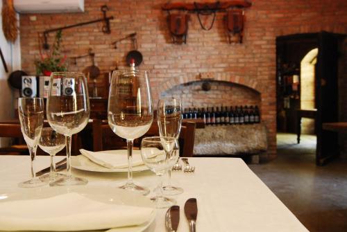 a group of wine glasses sitting on a table at Agriturismo Torrazzetta in Casteggio