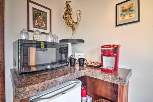 a kitchen with a counter with a microwave and a coffee maker at Cozy Volcano Studio with Phenomenal Rainforest Views in Mountain View
