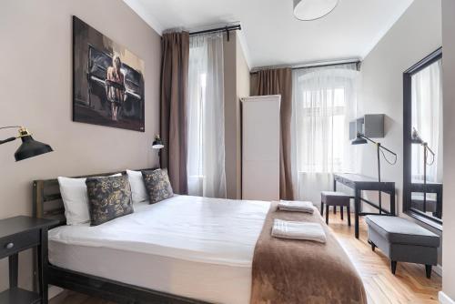 Ένα ή περισσότερα κρεβάτια σε δωμάτιο στο MARGI Nell Apartament
