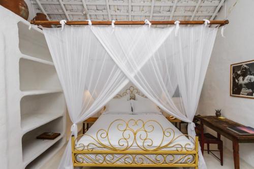 Ein Bett oder Betten in einem Zimmer der Unterkunft Pousada Sol da Manha QUADRADO