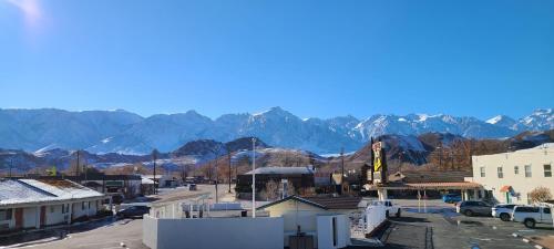 a large building with a mountain range at Dow Villa Motel in Lone Pine