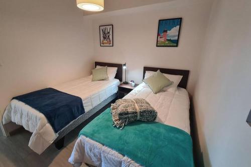 Katil atau katil-katil dalam bilik di Espectacular departamento con vista al mar en Mirador Barón Valparaíso