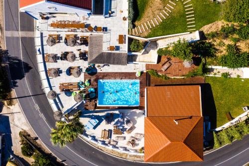 an overhead view of a building with a swimming pool at Lapoint Surf Camp Ericeira in Ericeira