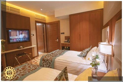 Ένα ή περισσότερα κρεβάτια σε δωμάτιο στο Bilitom Hotel