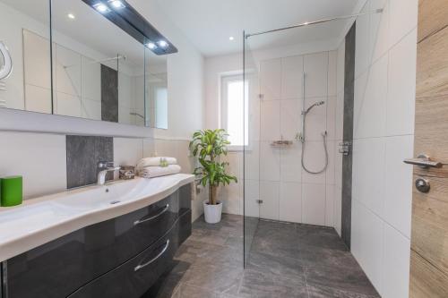 a bathroom with a sink and a shower at Apartment Jasmin in Neustift im Stubaital