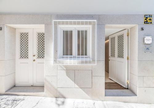 a rendering of a hallway with two white doors at Oporto Street das Aldas - River View in Porto