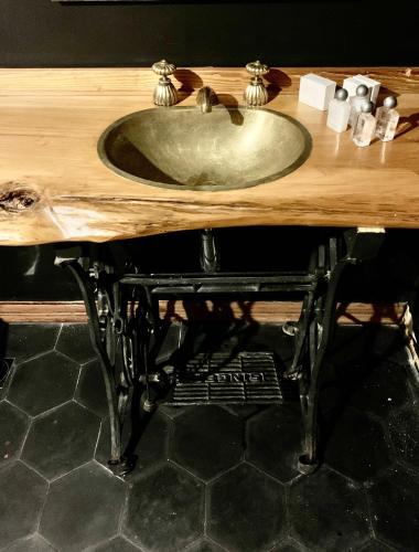 a wooden counter with a sink on top of it at Barradas Parque Hotel & Spa in Punta del Este