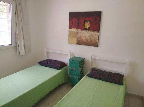 Giường trong phòng chung tại Casa Parque Playa