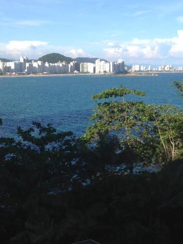 a view of a large body of water with a city at Guaruja Apartment in Guarujá