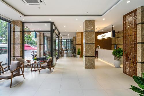a lobby of a building with chairs and tables at Aquatel Vung Tau in Vung Tau