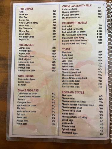 a picture of a menu for a restaurant at Nimmu Guest House & Restaurant Gokarna in Gokarna