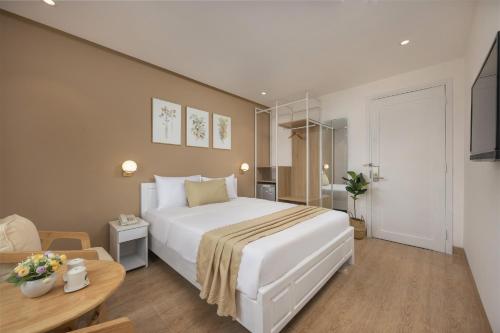 Cama o camas de una habitación en Nâng hạng phòng miễn phí - Amunra Hotel Đà Nẵng