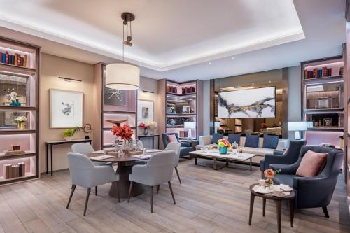a living room with a table and chairs at Address Beach Resort in Dubai