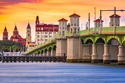 a bridge over the water with buildings in the background at 102 10th St. in Saint Augustine Beach