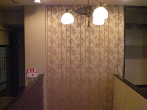 a wall with a floral pattern on it with two lights at Marina bay Numazu マリーナベイ沼津 BBQ可 in Numazu